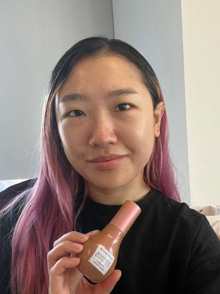 A selfie of Allure commerce editor Sarah Han after applying the Glow Recipe Watermelon Glow Niacinamide Hue Drop in Sun Glow